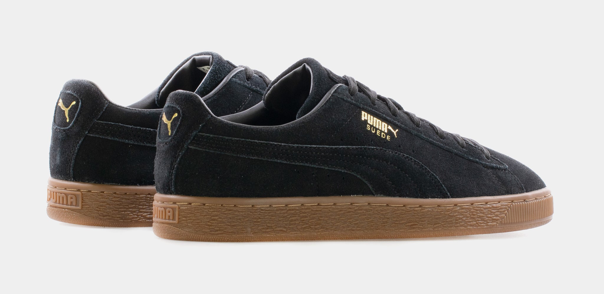 Puma suede trainers in black with hot sale gum sole