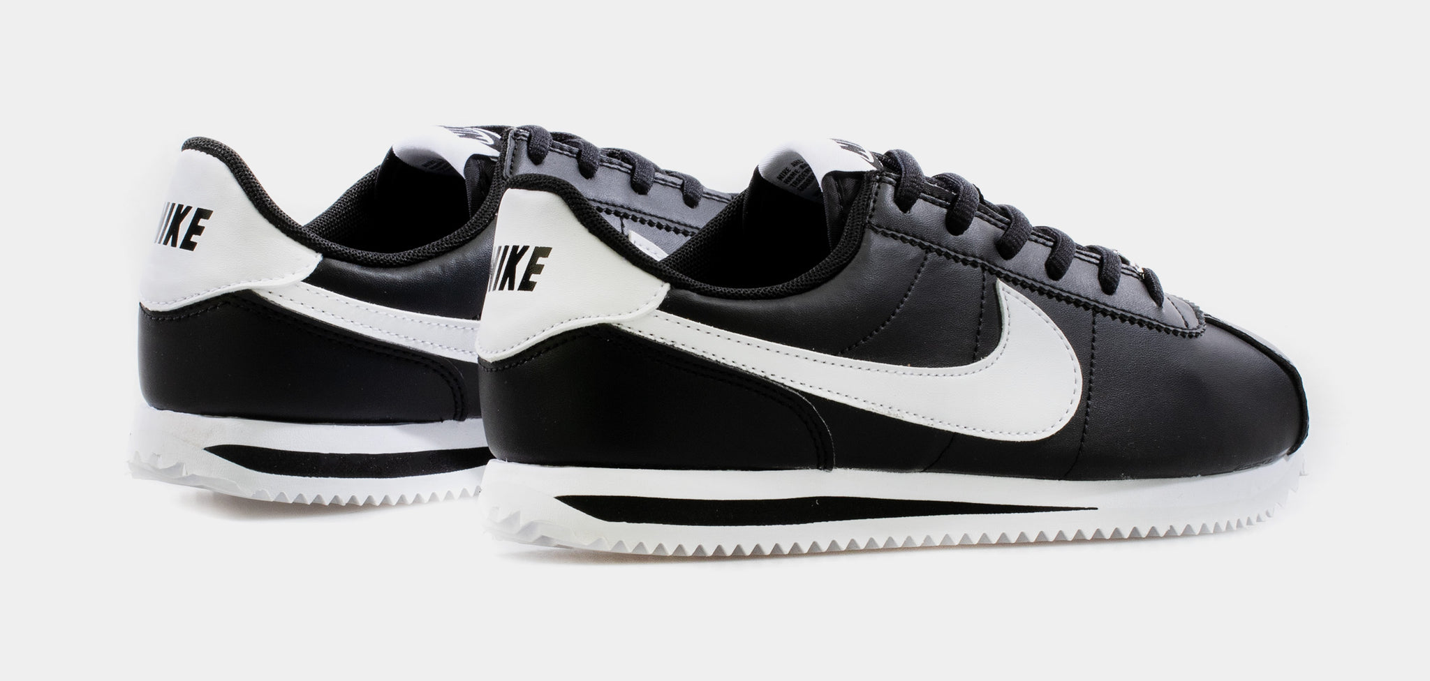 Nike cortez best sale black white leather