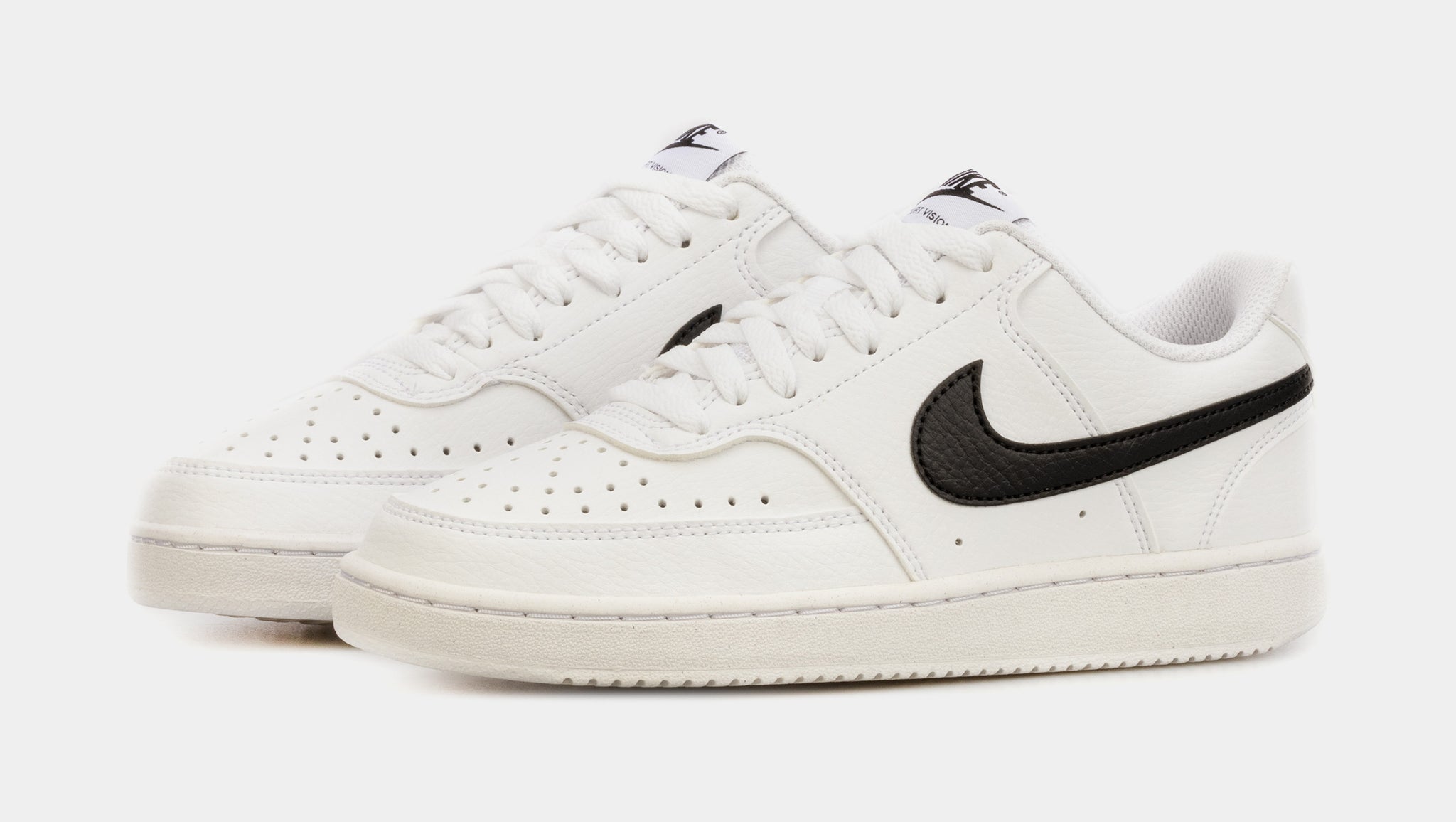 White nike trainers with black best sale tick womens