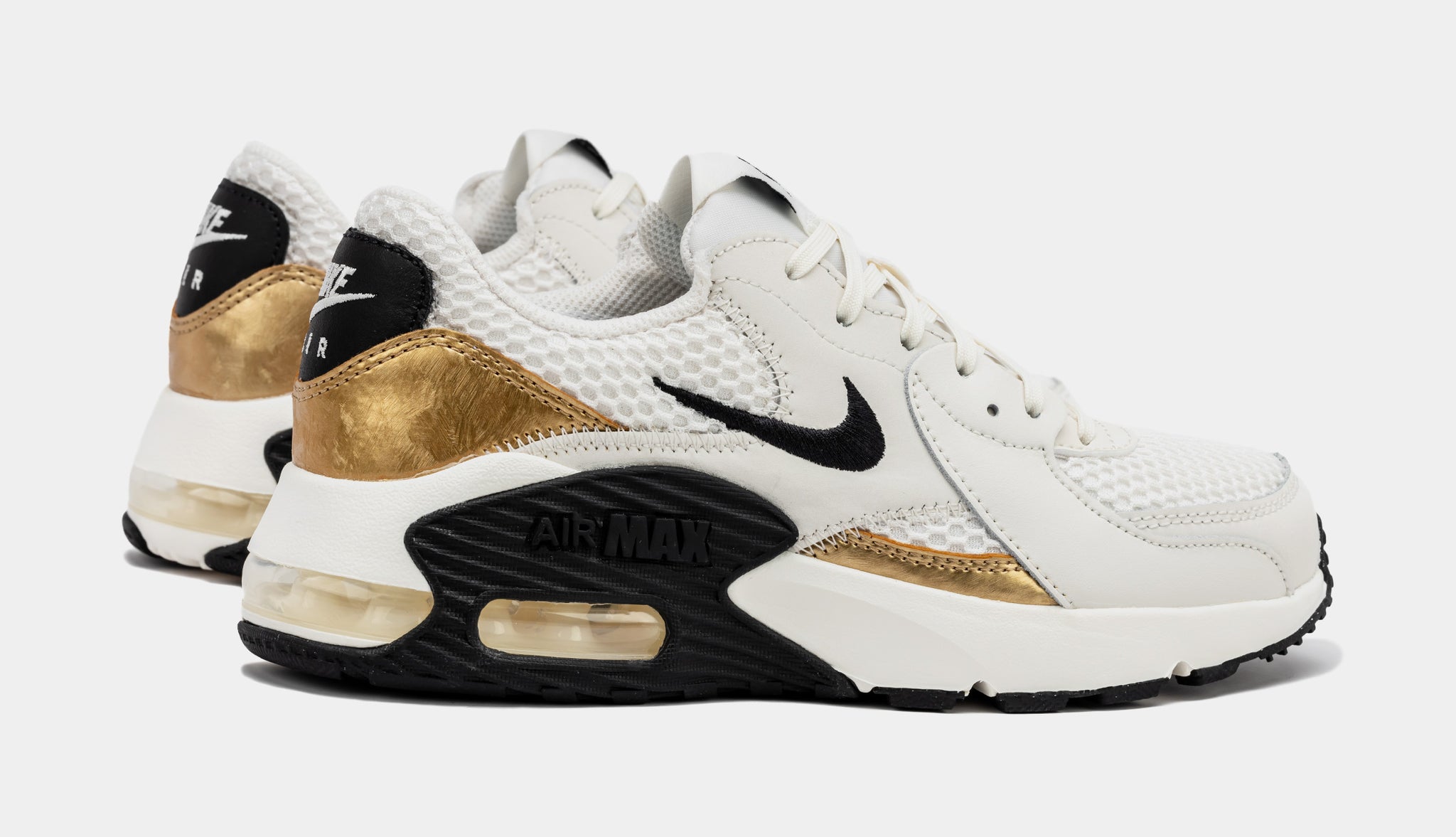 Black and gold hot sale ladies nike trainers